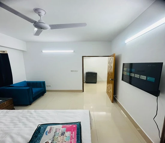 Furnished 2 room apartment in Dhaka, Property H5-551-A3, bedroom with a wall-mounted TV and blue sofa